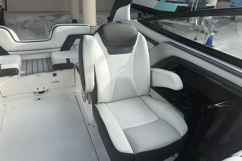Slide: The Image of Interior of 2018 Yamaha Boats 242 Limited S E-Series, featuring sleek seating and modern design. - 26