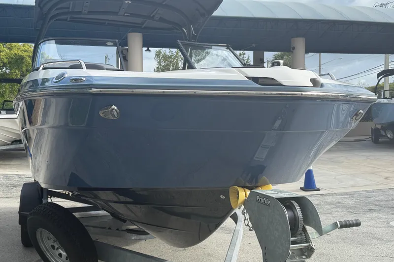 Slide: The Image of 2018 Yamaha Boats 242 Limited S E-Series on trailer, sleek design, outdoor display. - 7