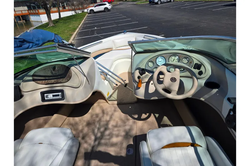 Slide: The Image of Interior view of a 2001 Caravelle 188 Bow Rider boat with steering wheel and dashboard. - 10