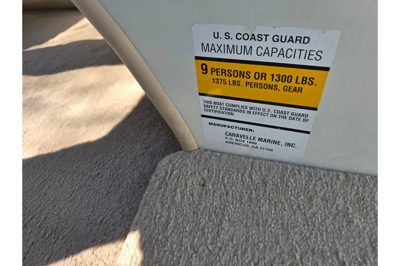 Slide: The Image of U.S. Coast Guard capacity label on 2001 Caravelle 188 Bow Rider boat. - 15