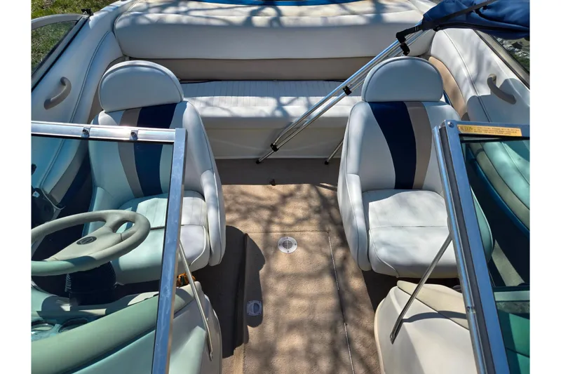 Slide: The Image of 2001 Caravelle 188 Bow Rider interior with white and blue seating. - 18