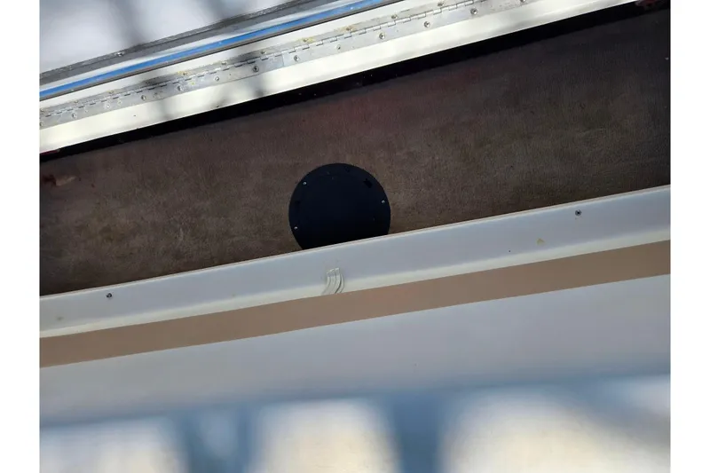 Slide: The Image of Interior view of a 2001 Caravelle 188 Bow Rider boat, featuring carpeted flooring. - 20