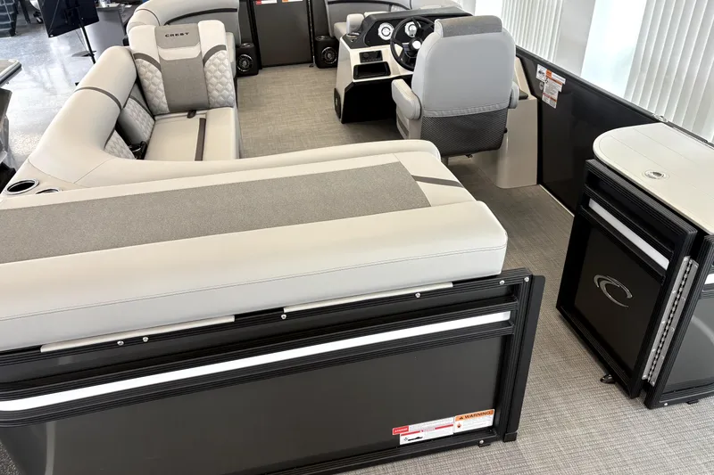 Slide: The Image of Interior of 2026 Crest 210L Conquest pontoon boat with modern seating and helm. - 4