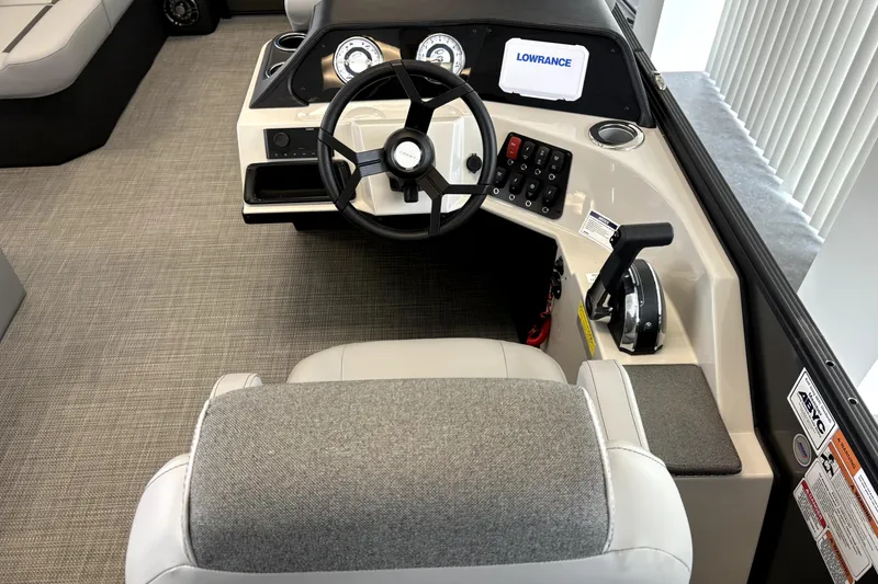 Slide: The Image of Interior view of a Crest 210L Conquest boat helm, model year 2026. - 7