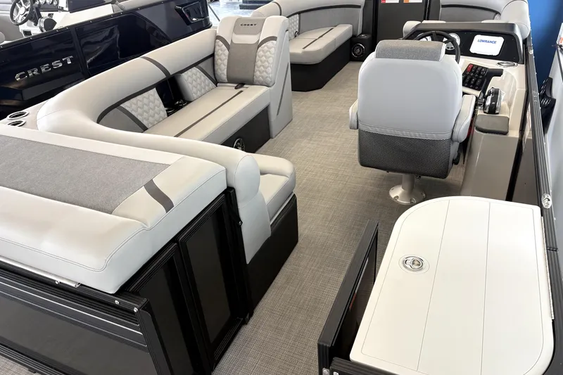 Slide: The Image of Interior of 2026 Crest 210L Conquest with luxurious seating. - 8