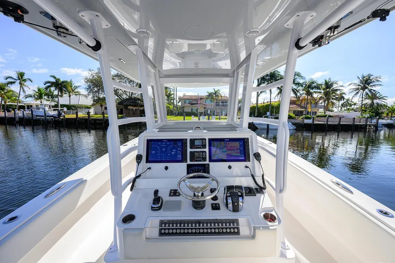 Slide: The Image of 2021 Invincible 39 Open Fisherman boat cockpit with advanced navigation systems. - 19