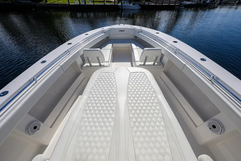 Slide: The Image of 2021 Invincible 39 Open Fisherman boat interior with luxurious seating and water view. - 31