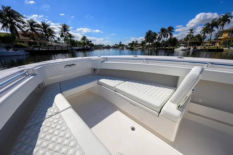 Slide: The Image of Luxurious seating on 2021 Invincible 39 Open Fisherman boat, with scenic waterfront view. - 33