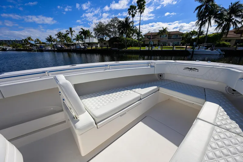 Slide: The Image of 2021 Invincible 39 Open Fisherman boat interior with luxurious seating and waterfront view. - 34