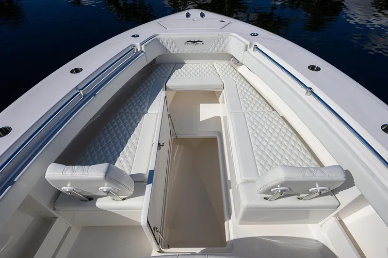 Slide: The Image of 2021 Invincible 39 Open Fisherman boat interior with white cushioned seating. - 41