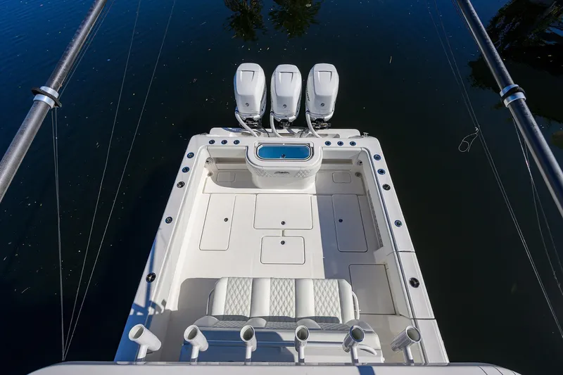 Slide: The Image of 2021 Invincible 39 Open Fisherman boat with triple outboard engines, viewed from above. - 46