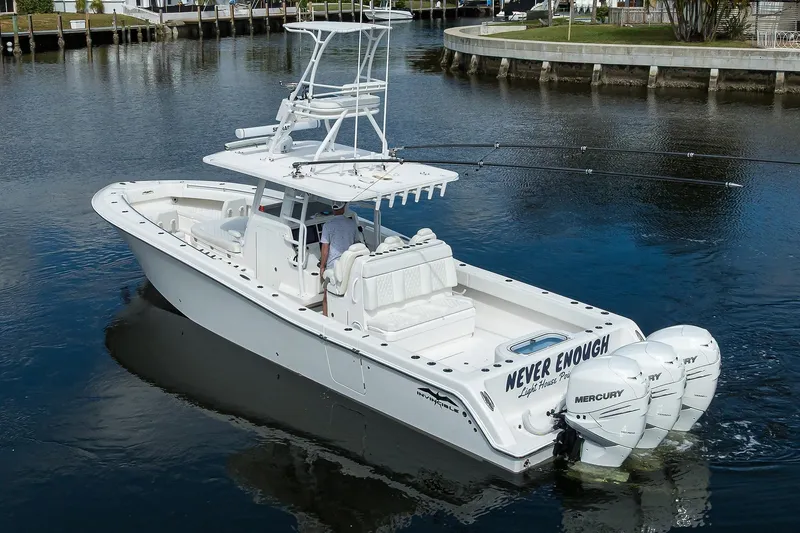 Slide: The Image of 2021 Invincible 39 Open Fisherman boat with triple Mercury engines on calm water. - 5
