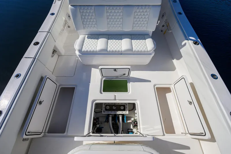 Slide: The Image of 2021 Invincible 39 Open Fisherman boat interior with storage compartments and seating. - 56