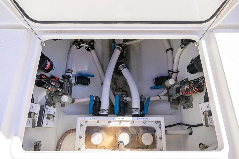 Slide: The Image of 2021 Invincible 39 Open Fisherman boat plumbing system with valves and hoses. - 59