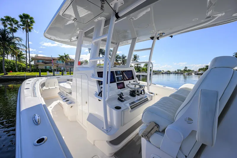 Slide: The Image of 2021 Invincible 39 Open Fisherman boat interior with modern helm and seating. - 76