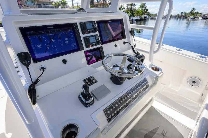 Slide: The Image of 2021 Invincible 39 Open Fisherman boat dashboard with advanced navigation controls. - 77