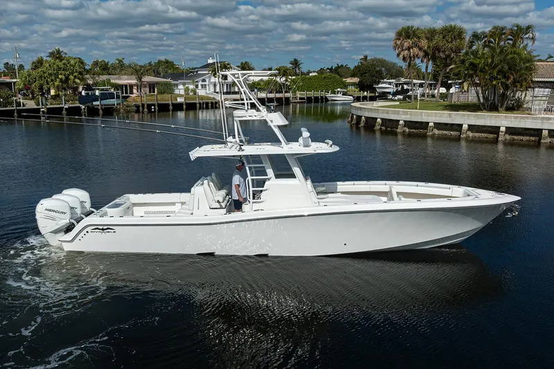 Slide: The Image of 2021 Invincible 39 Open Fisherman boat cruising on a calm waterway. - 9