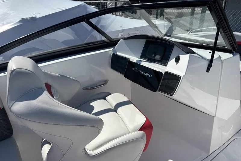 Slide: The Image of 2020 Hurricane SunDeck 191 OB boat interior with steering console and seating. - 10