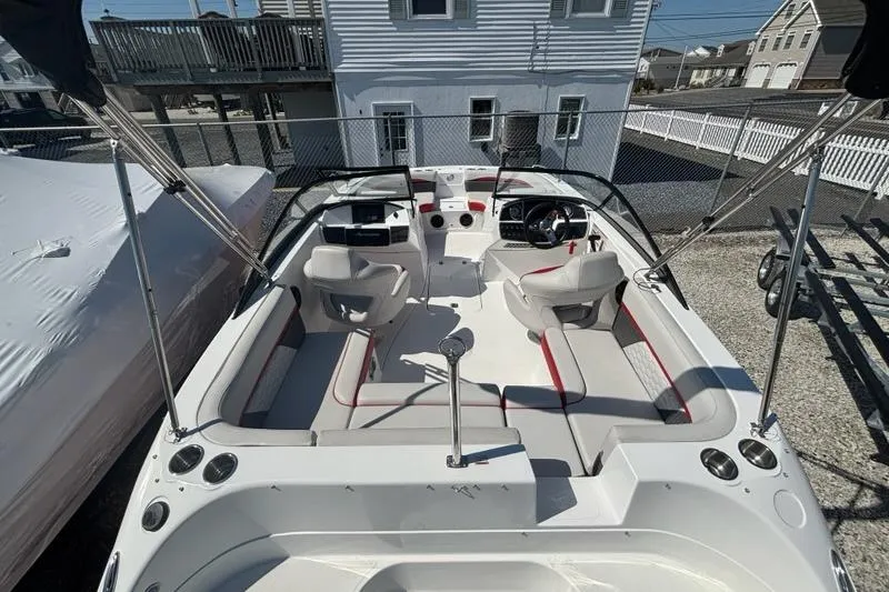 Slide: The Image of 2020 Hurricane SunDeck 191 OB boat interior with seating and steering console. - 8