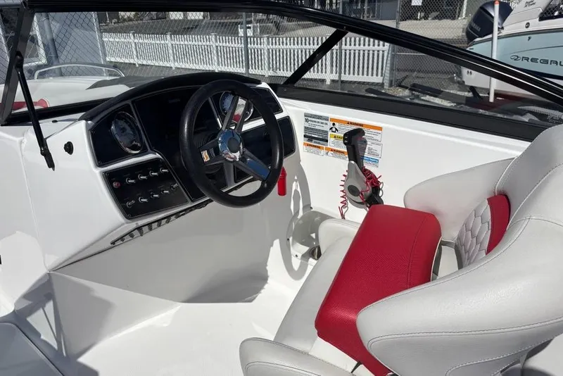 Slide: The Image of 2020 Hurricane SunDeck 191 OB boat cockpit with steering wheel and control panel. - 9