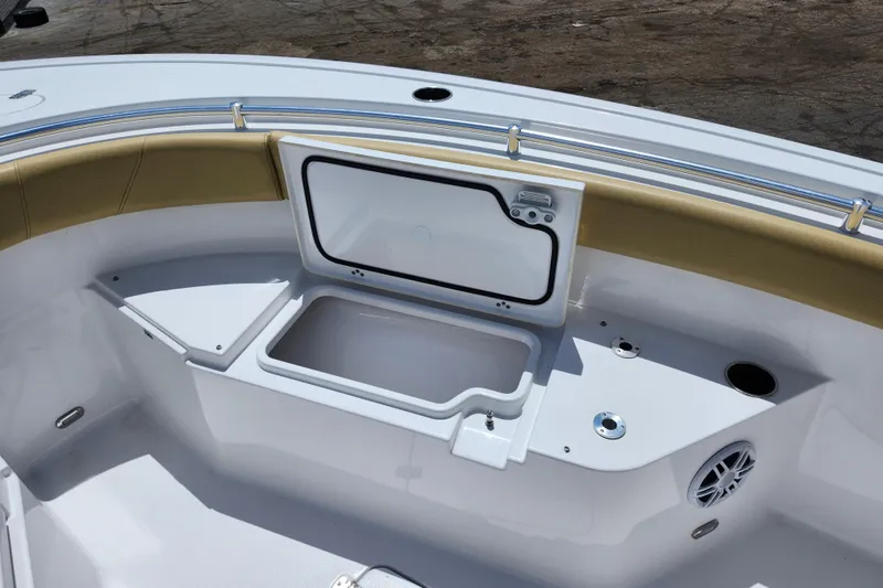 Slide: The Image of 2024 Sportsman Open 232 Center Console boat interior with storage compartment and seating. - 19