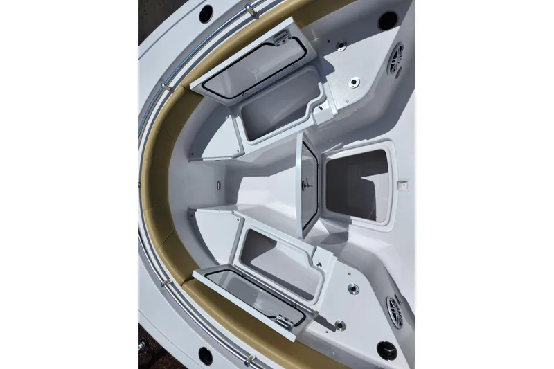 Slide: The Image of 2024 Sportsman Open 232 Center Console boat with open storage compartments and seating area. - 20