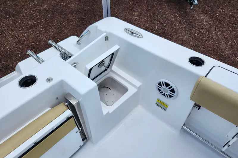 Slide: The Image of 2024 Sportsman Open 232 Center Console boat interior with storage and seating features. - 35
