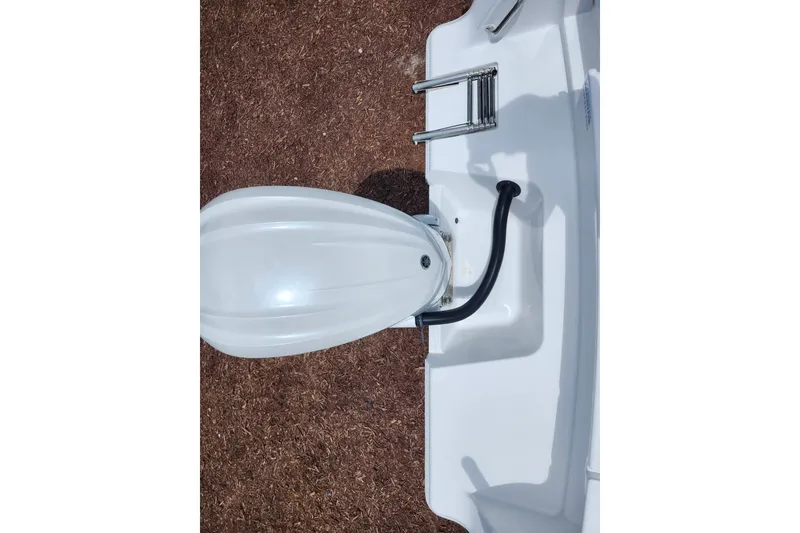 Slide: The Image of 2024 Sportsman Open 232 Center Console boat stern with ladder and engine mount. - 40