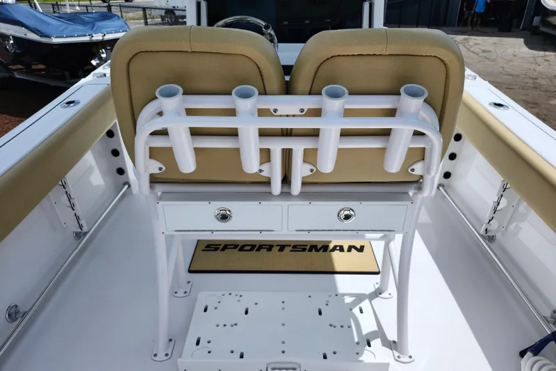 Slide: The Image of 2024 Sportsman Open 232 Center Console boat interior with rod holders and seating. - 42