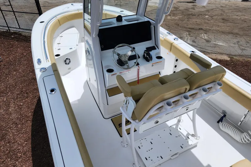 Slide: The Image of 2024 Sportsman Open 232 Center Console boat interior with helm and seating. - 48
