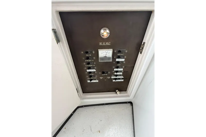 Slide: The Image of Electrical panel of a 1988 President 35 Double Cabin boat, featuring various switches and gauges. - 10
