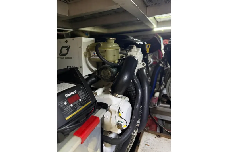 Slide: The Image of Engine compartment of a 1988 President 35 Double Cabin boat. - 14