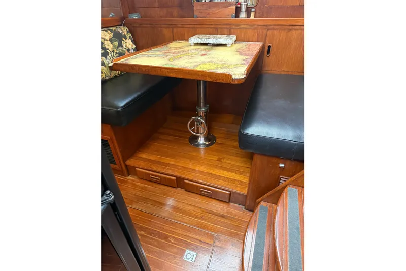 Slide: The Image of Interior of 1988 President 35 Double Cabin with wooden flooring and cushioned seating. - 22