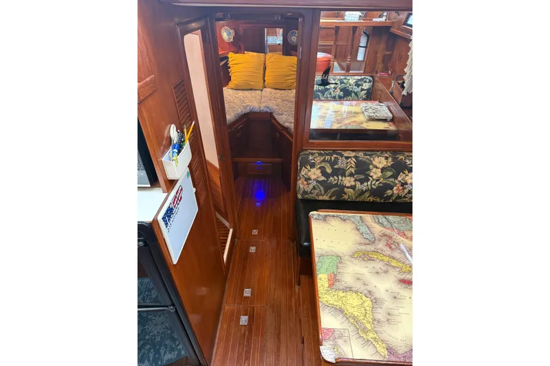Slide: The Image of Interior of 1988 President 35 Double Cabin yacht with wood finish and floral upholstery. - 25
