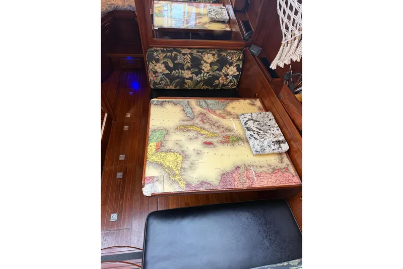 Slide: The Image of 1988 President 35 Double Cabin interior with vintage map table and floral upholstery. - 26