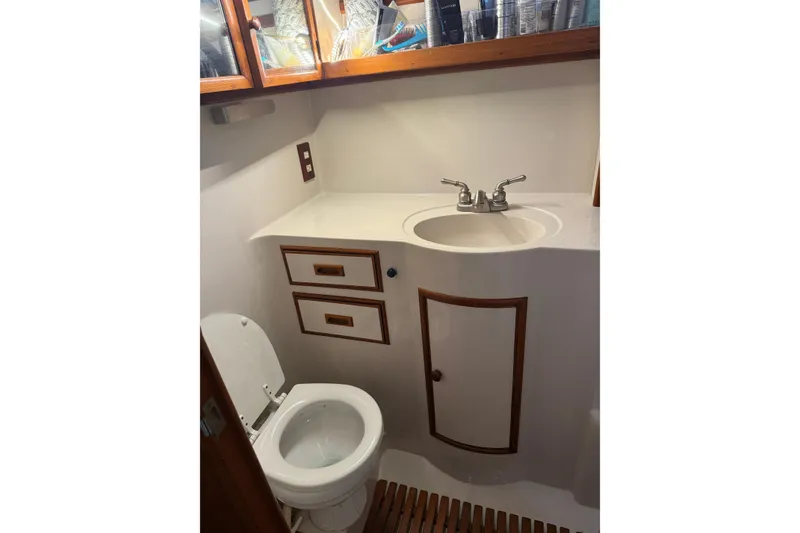 Slide: The Image of Bathroom interior of 1988 President 35 Double Cabin yacht, featuring sink and toilet. - 30