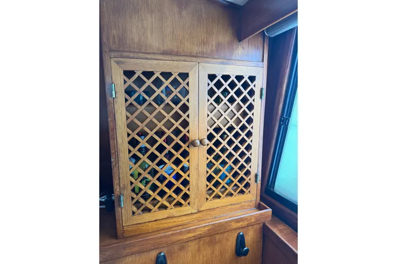 Slide: The Image of Wooden lattice cabinet in 1988 President 35 Double Cabin boat interior. - 34