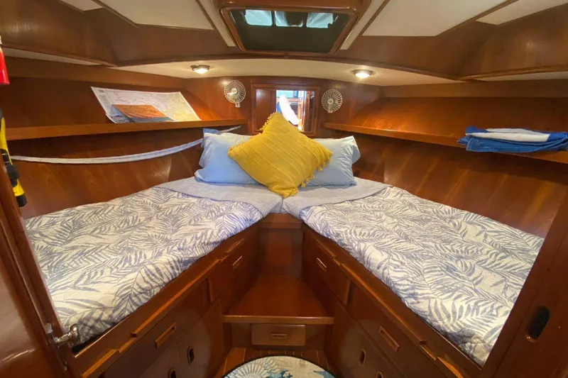 Slide: The Image of Cozy cabin interior of 1988 President 35 Double Cabin yacht with twin beds and wooden finish. - 42