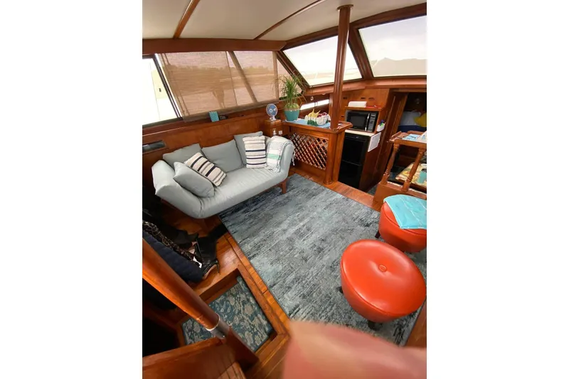 Slide: The Image of Interior of 1988 President 35 Double Cabin yacht with cozy seating and modern decor. - 43