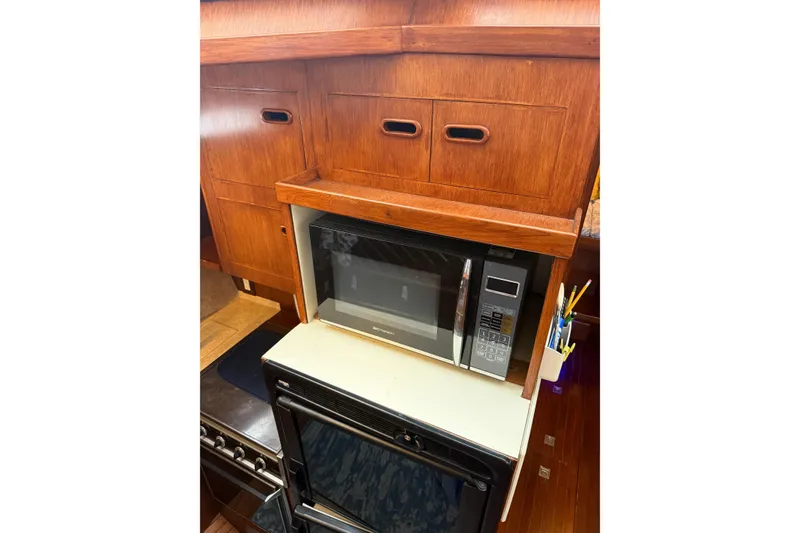 Slide: The Image of 1988 President 35 Double Cabin kitchen with microwave and wooden cabinetry. - 6