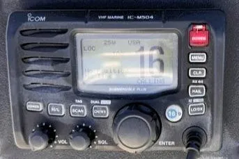Slide: The Image of ICOM VHF Marine IC-M504 radio on a 1991 Bertram 28 boat dashboard. - 15