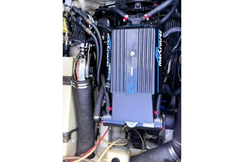 Slide: The Image of 1991 Bertram 28 boat engine compartment featuring a MerCruiser engine. - 19