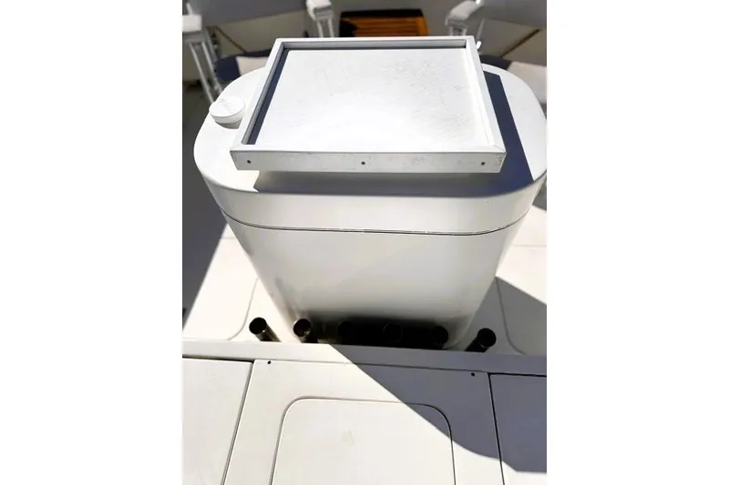 Slide: The Image of 1991 Bertram 28 boat deck with storage compartment and hatch. - 21