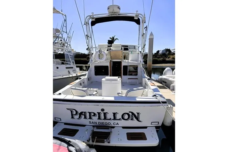 Slide: The Image of 1991 Bertram 28 boat named "Papillon" docked in San Diego, CA. - 4