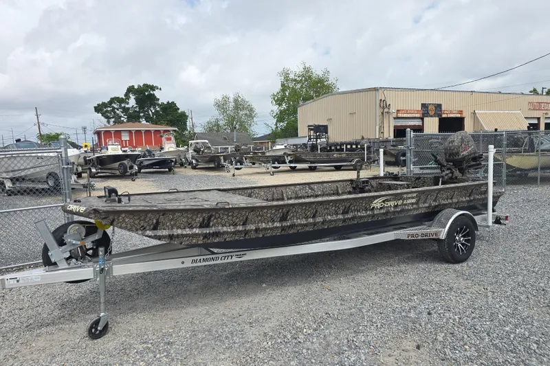 Slide: The Image of 2026 Pro-Drive 2060 boat on trailer in outdoor dealership lot. - 8