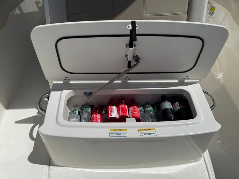 Slide: The Image of Cooler on Boston Whaler 230 Outrage boat, filled with beverages. - 13
