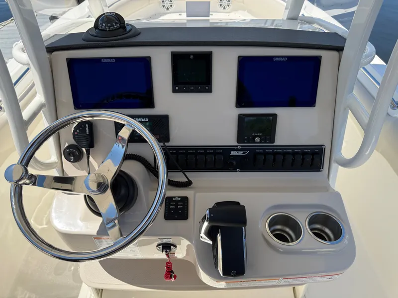 Slide: The Image of 2024 Boston Whaler 230 Outrage helm with Simrad electronics. - 21