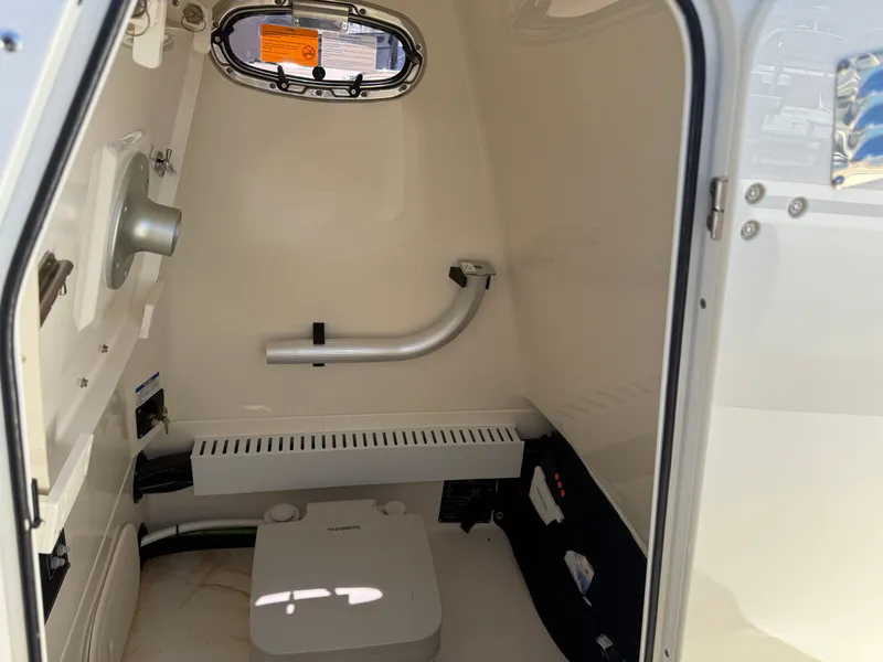 Slide: The Image of Interior of 2024 Boston Whaler 230 Outrage with modern amenities. - 23