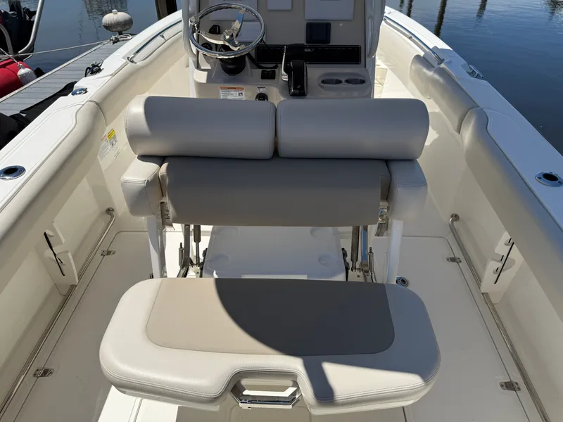 Slide: The Image of Interior of 2024 Boston Whaler 230 Outrage with helm and seating area. - 30