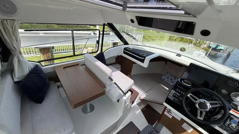 Slide: The Image of Interior of 2024 Jeanneau NC 795 Series 2 with modern helm station. - 30